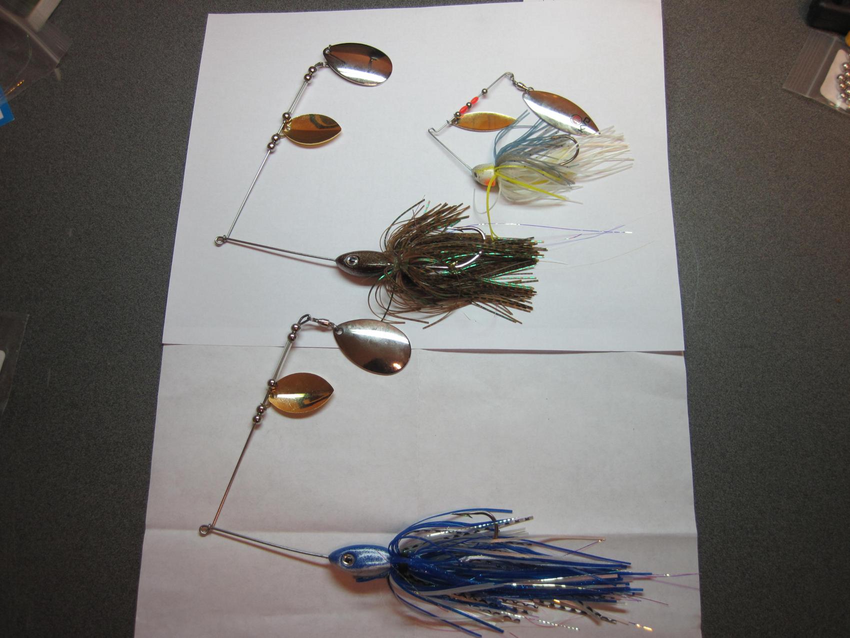 these are both 1 1/2 oz. lures, on bottom has a larger 7" skirt the top has a 5" skirt  next to a smaller 5/8oz.
